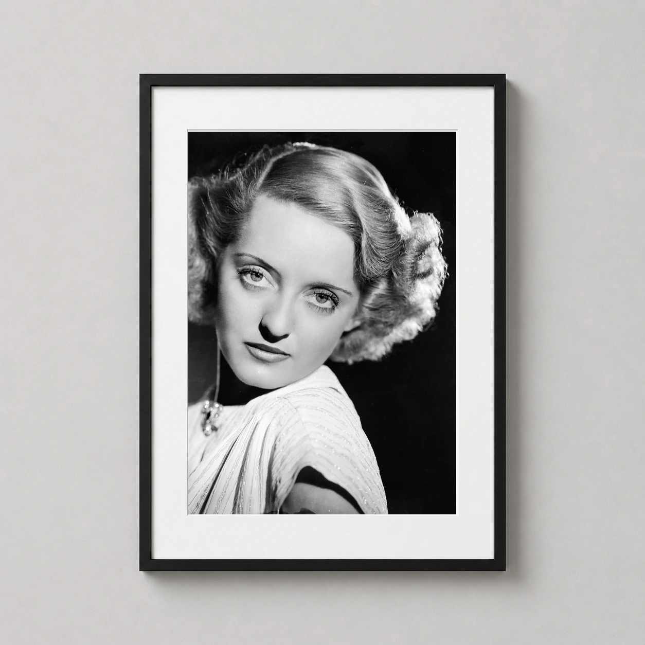 Bette Davis 1930s Warner — high-contrast black and white 1930s studio portrait of Bette Davis