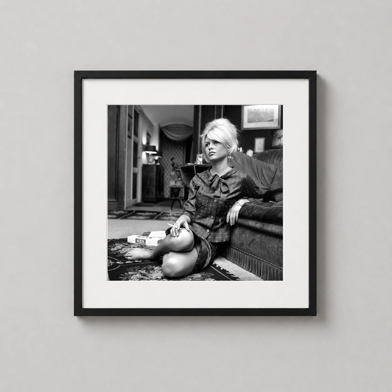 Brigitte Bardot Paris Apartment — monochrome photograph of Brigitte Bardot sitting on the floor with a