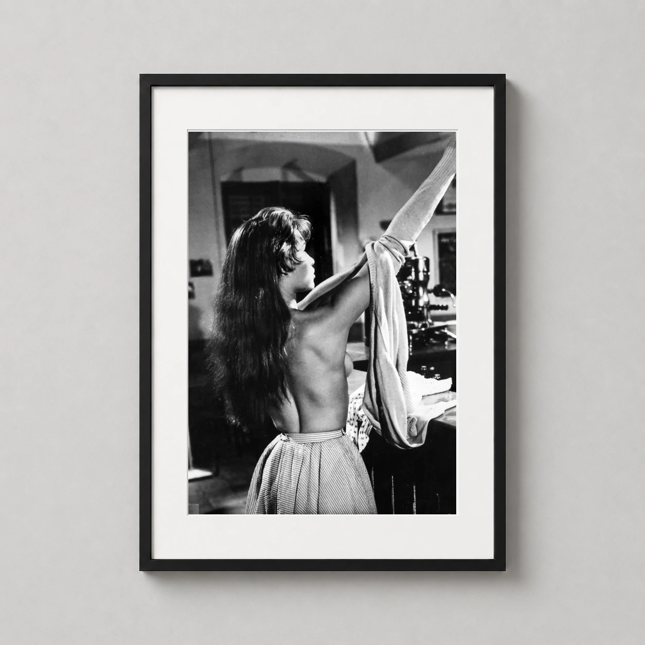 Brigitte Bardot Back — monochrome photograph of Brigitte Bardot from behind, capturing a