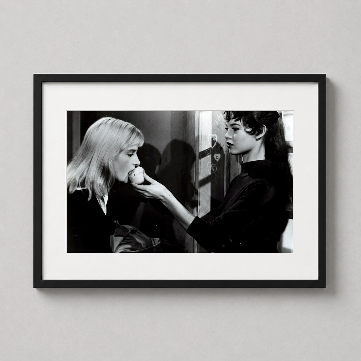 Brigitte Bardot Behind Scenes — candid black and white photograph of Brigitte Bardot in a makeup room