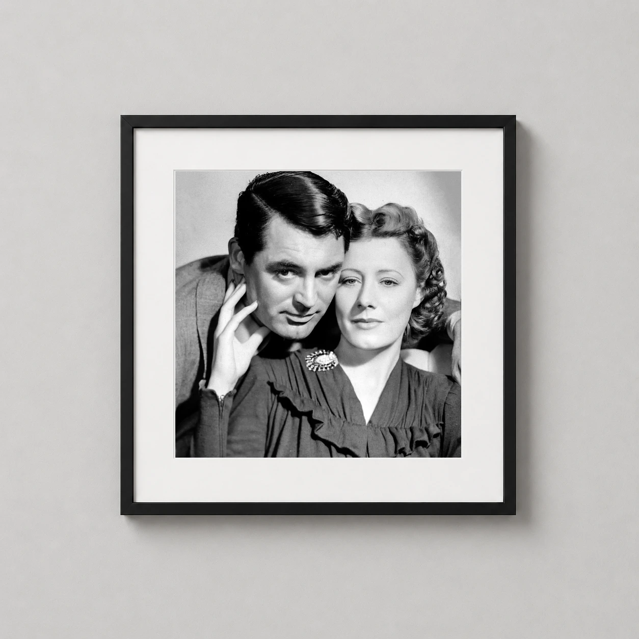 Cary Grant — close-up black and white studio portrait of Cary Grant and Irene Dunne