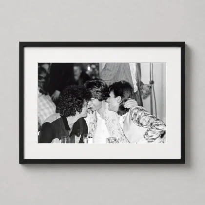David Bowie party table print showing a black and white table conversation with Bowie leaning into a lively party moment as