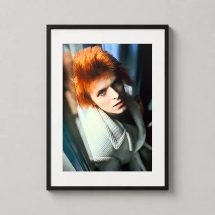 David Bowie red hair closeup print showing a close colour portrait with vivid red hair and an upward, intense gaze as David