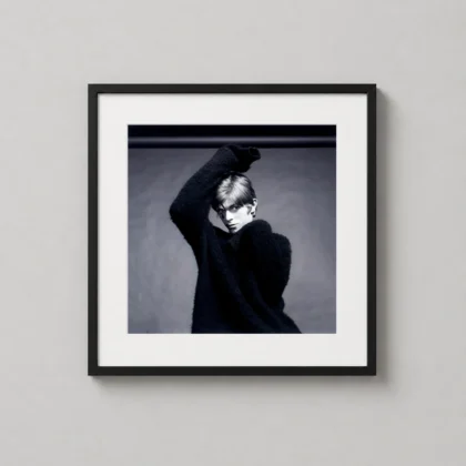 David Bowie Aladdin pose print showing a black and white Aladdin-era studio pose with raised arm, dark sweater, and dramatic