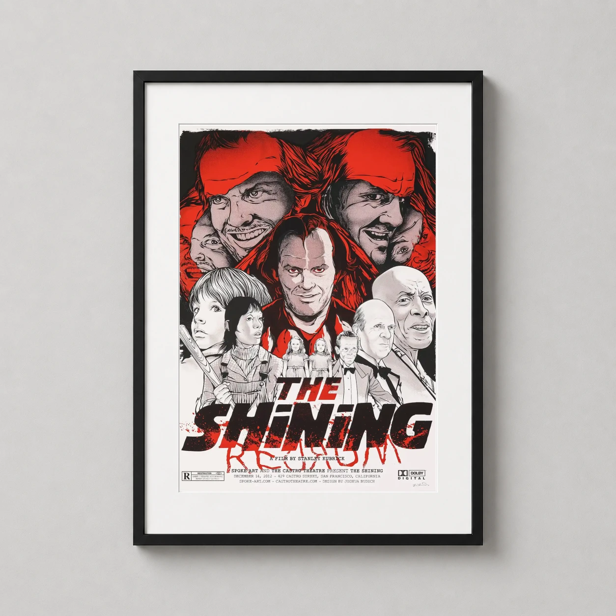 Room mockup of The Shining Joshua Budich Illustrated Horror Movie Poster, displayed as framed wall art in a home theater setting as a portrait print with red and black tones.