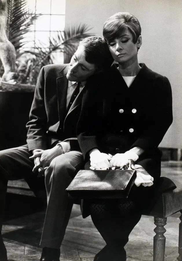 Audrey Hepburn and Peter O'Toole in a black and white photography print from the film How to Steal a Million, showing them seated side by side.