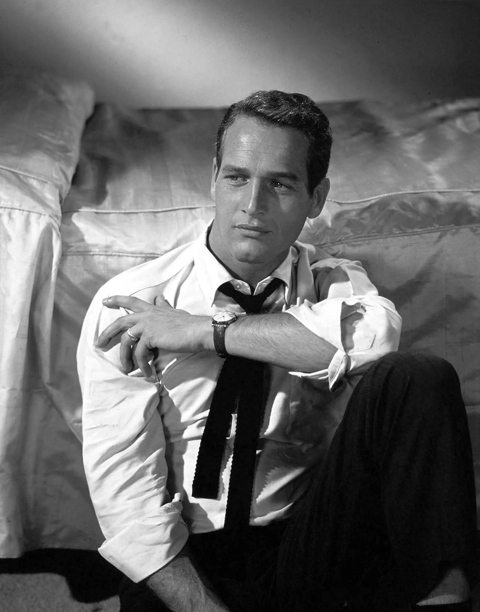 Paul Newman 1958 Sofa — seated 1958 sofa portrait shows Paul Newman in a rolled white shirt
