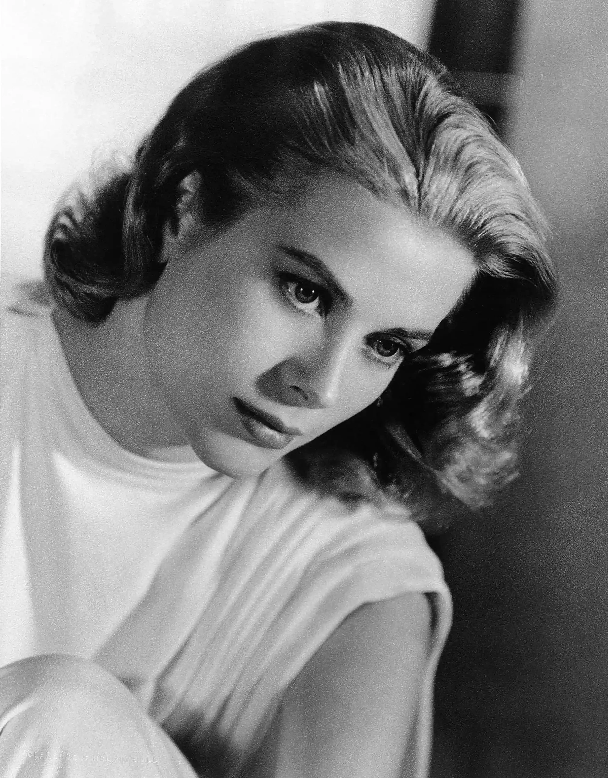 Grace Kelly 1956 poster showing a soft-focus black-and-white studio portrait with swept hair.