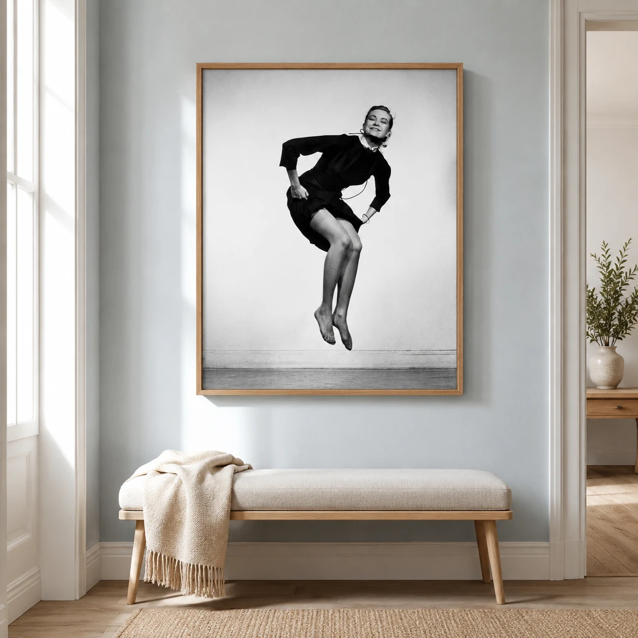 Room mockup of Grace Kelly Poster, 1953 Jumping Studio Photography Print, displayed as framed wall art in a office setting as a portrait print with black and white tones.