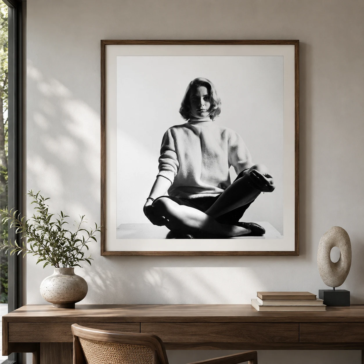 Room mockup of Grace Kelly Seated Poster, 1953 Studio Photo Print, displayed as framed wall art in a office setting as a portrait print with black and white tones.