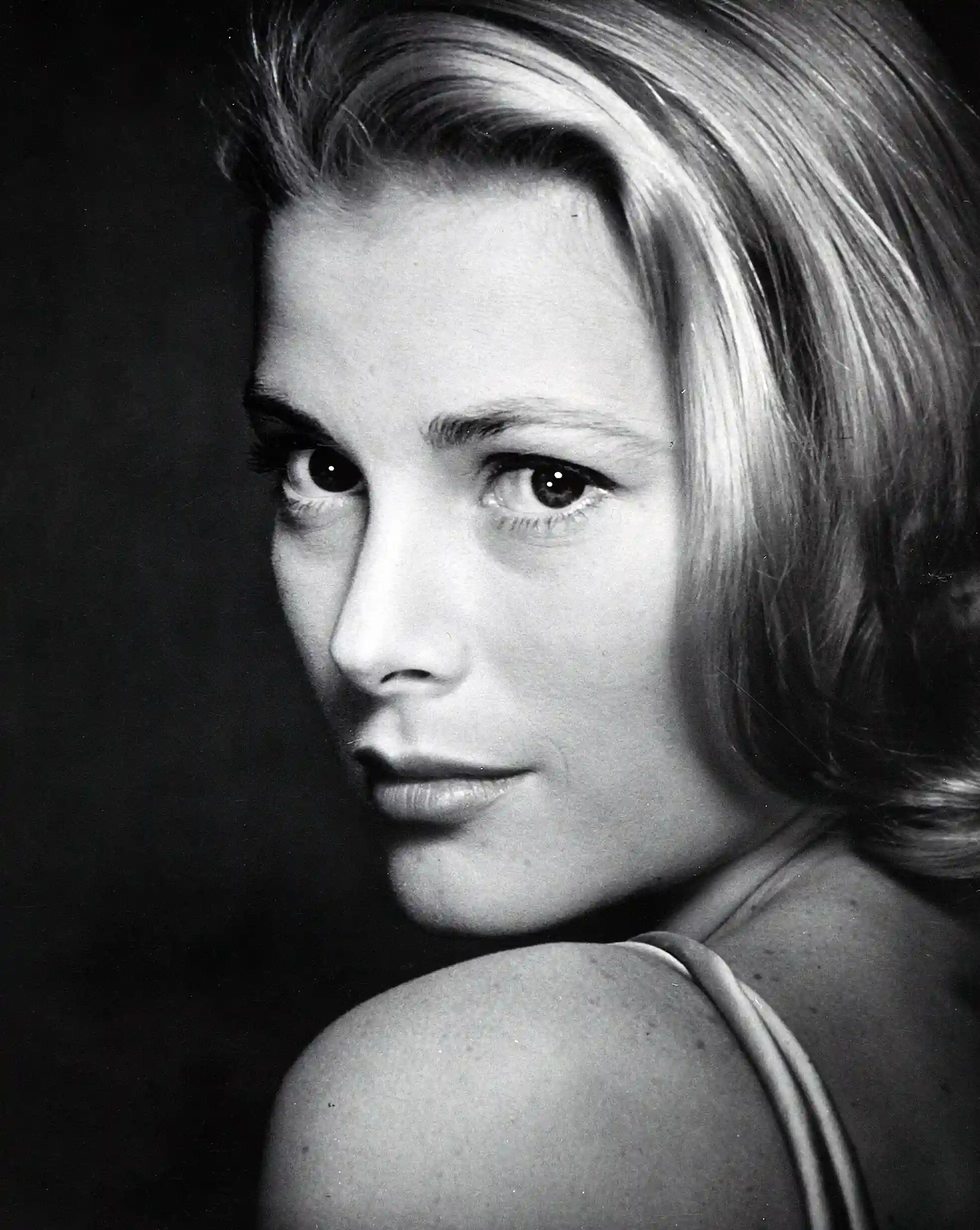 Grace Kelly LIFE poster showing a tight 1955 Halsman close-up with shoulder turn.