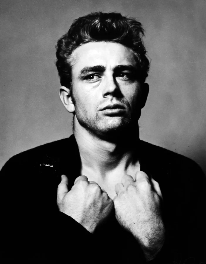 James Dean torn sweater poster with clenched hands and a shadowed 1954 portrait.