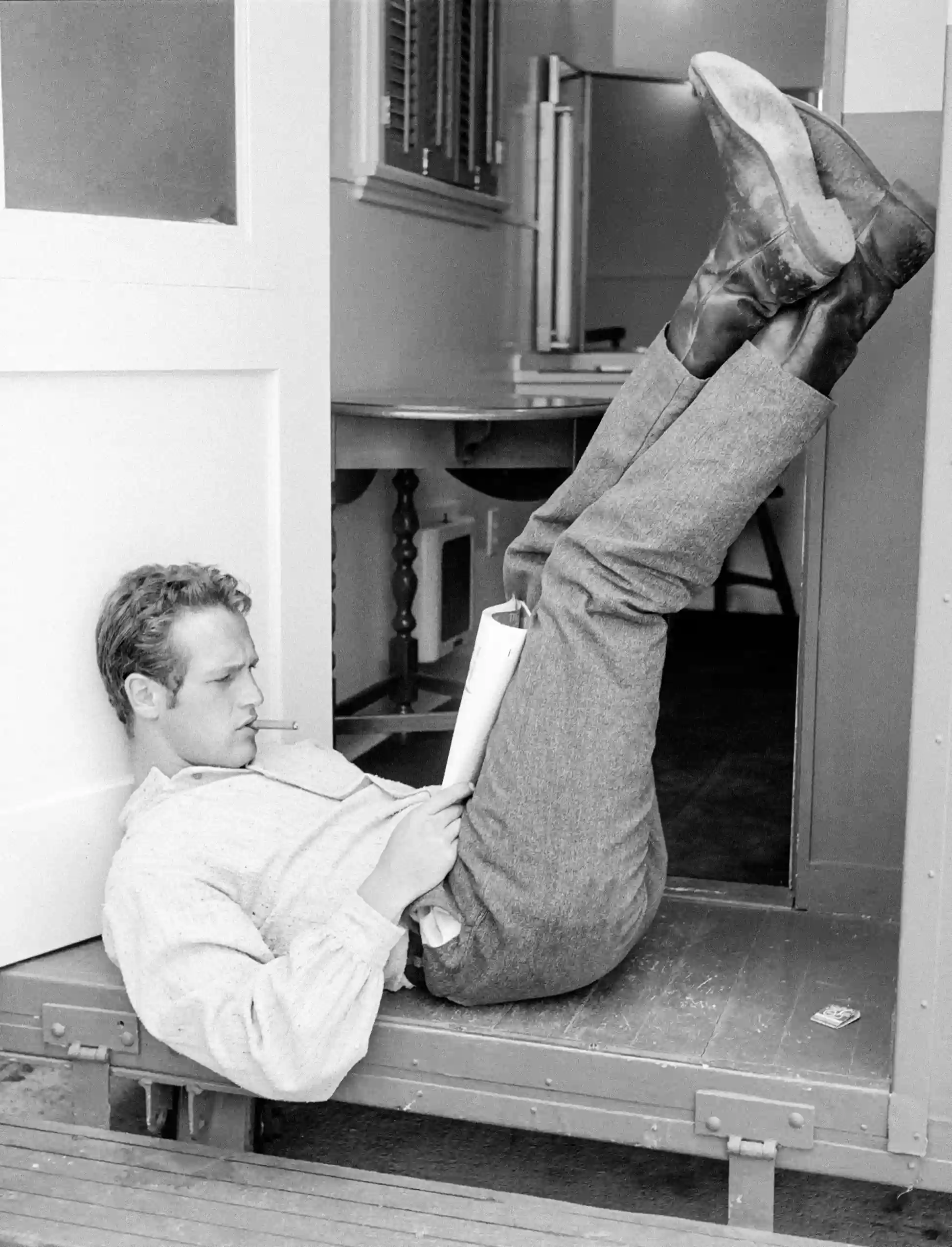 Paul Newman Reading New — 1958 candid shows Paul Newman lounging while reading The New Yorker
