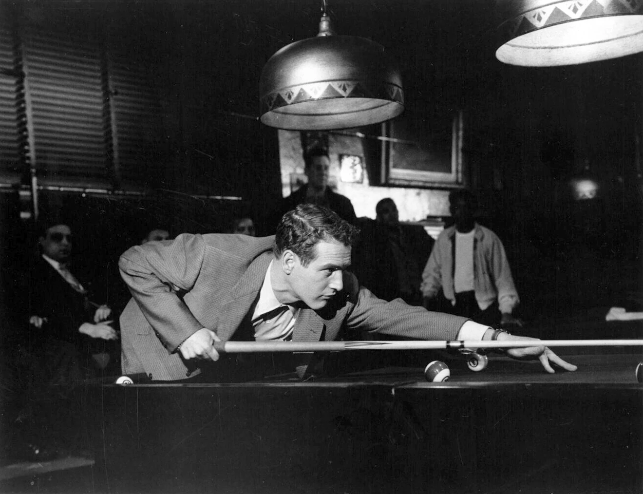 Paul Newman — paul Newman leans low over a billiards table, with the cue line and