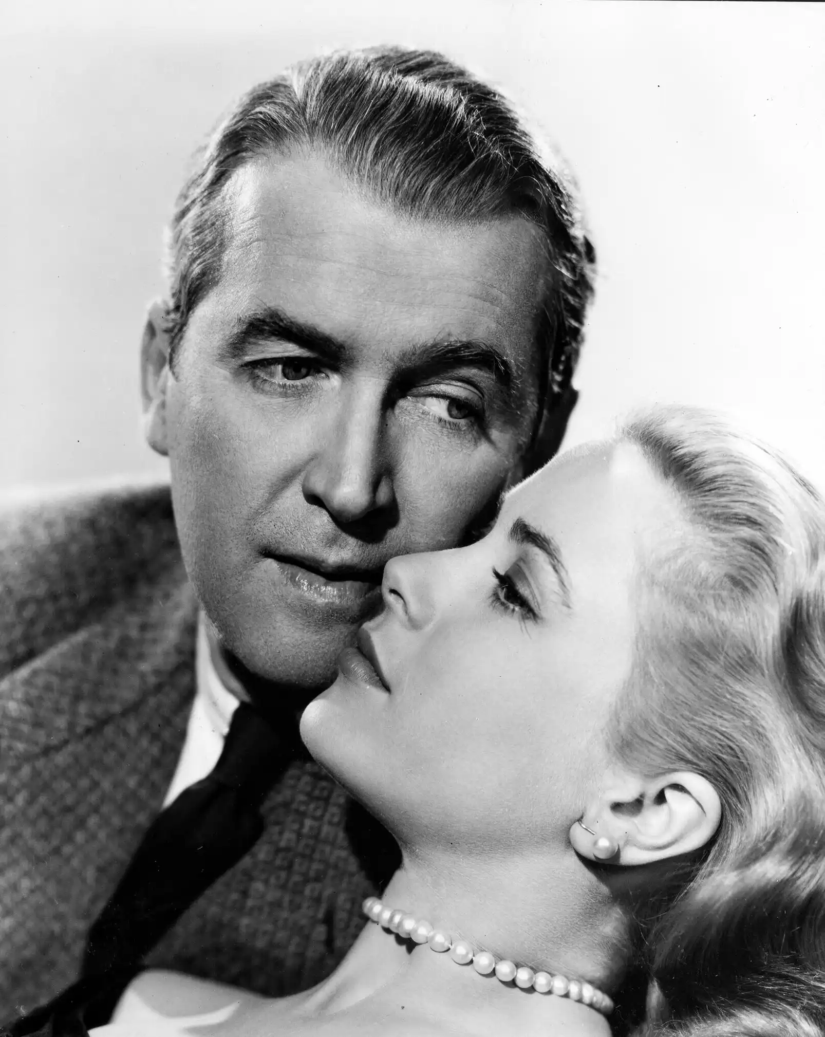 Rear Window Grace poster showing James Stewart and Grace Kelly in a close 1954 film portrait.