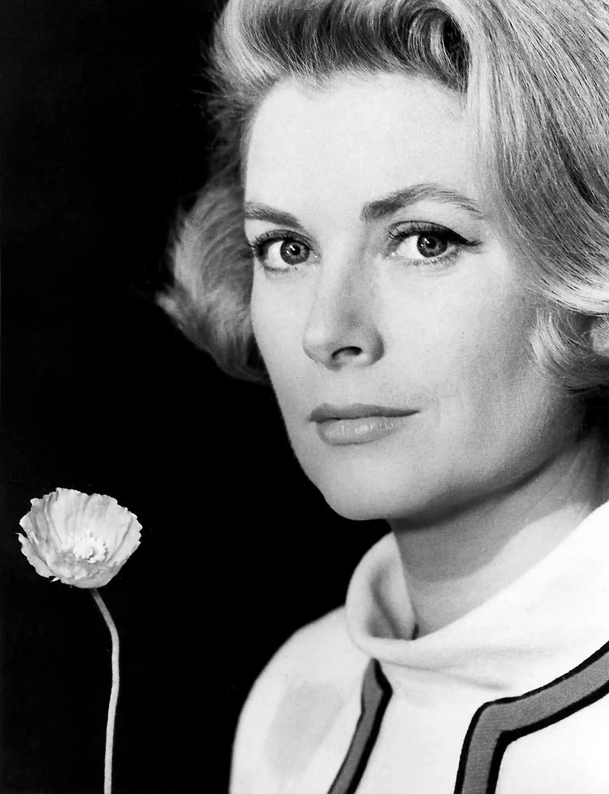 Grace Kelly flower poster showing a close black-and-white studio portrait with a white bloom.