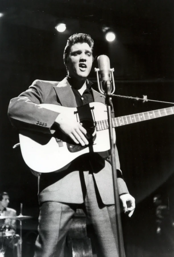Alfred Wertheimer poster showing Elvis Presley performing on stage in 1956.
