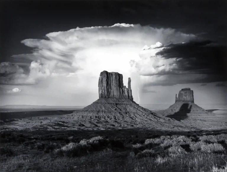 Anthony J Beckesh poster showing Monument Valley’s Mittens under thunderclouds.
