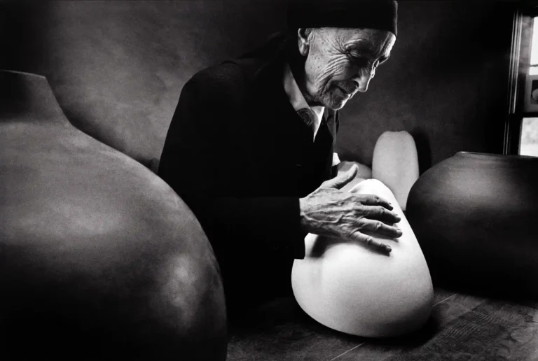 Dan Budnik poster showing Georgia O’Keeffe at Ghost Ranch with pots by Juan Hamilton.