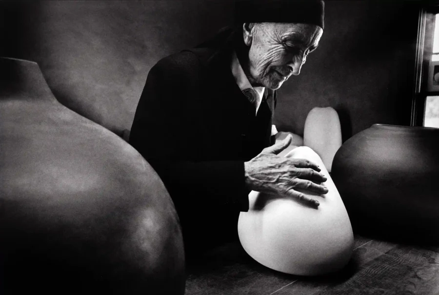 Dan Budnik poster showing Georgia O’Keeffe at Ghost Ranch with pots by Juan Hamilton.