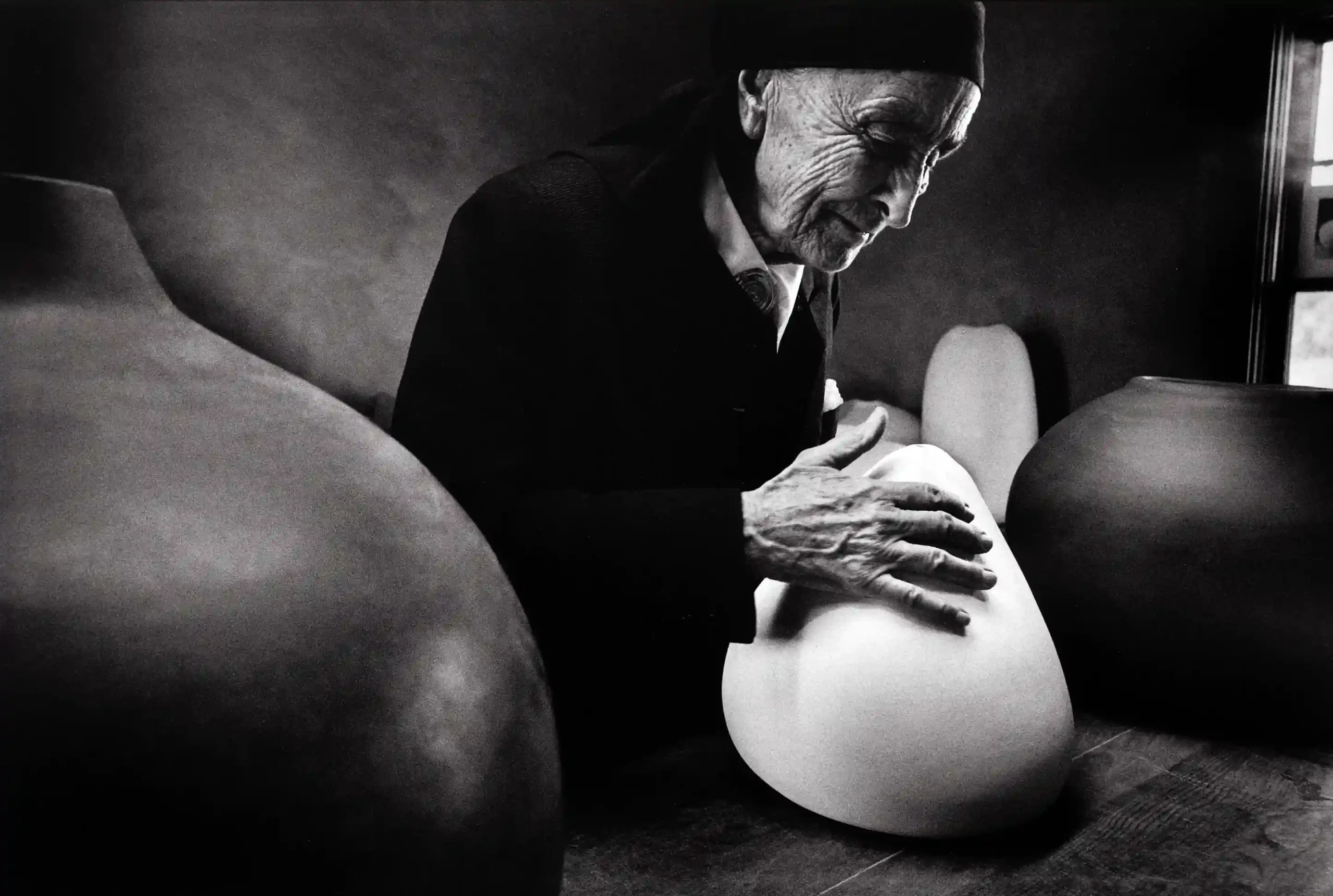Dan Budnik poster showing Georgia O’Keeffe at Ghost Ranch with pots by Juan Hamilton.