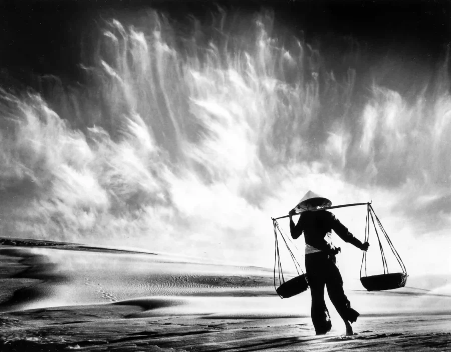 Don Hong-Oai poster showing a Vietnam sandstorm scene in pictorial photographic style.