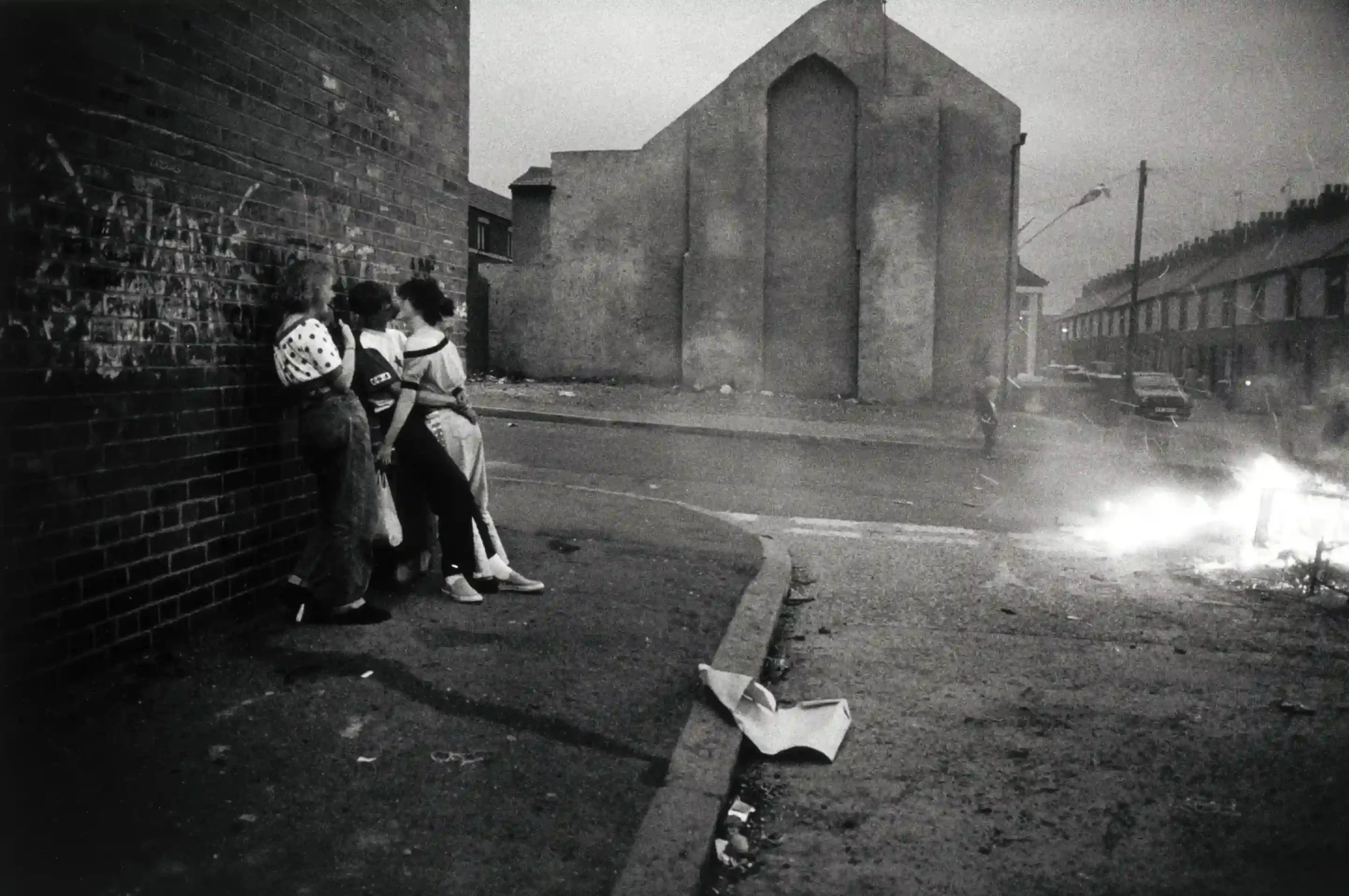 Gilles Peress poster showing a summer evening in Woodvale, Belfast during 1989.