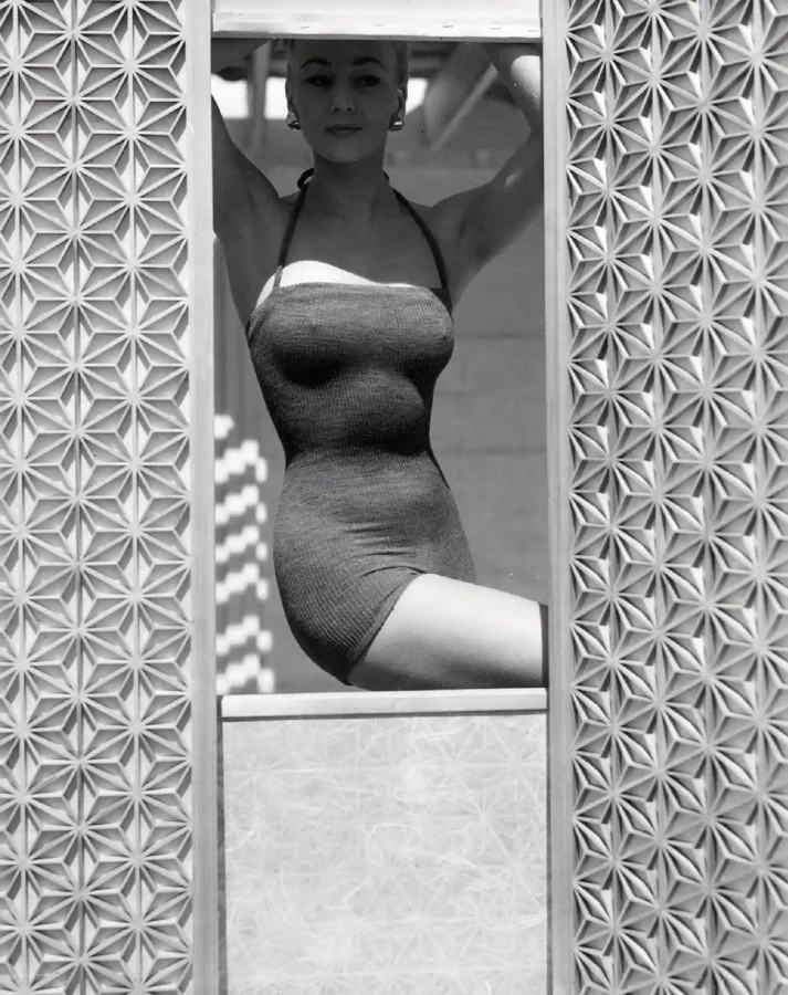 Horst P. Horst poster showing a fashion model in a woolen swimsuit framed between screens.