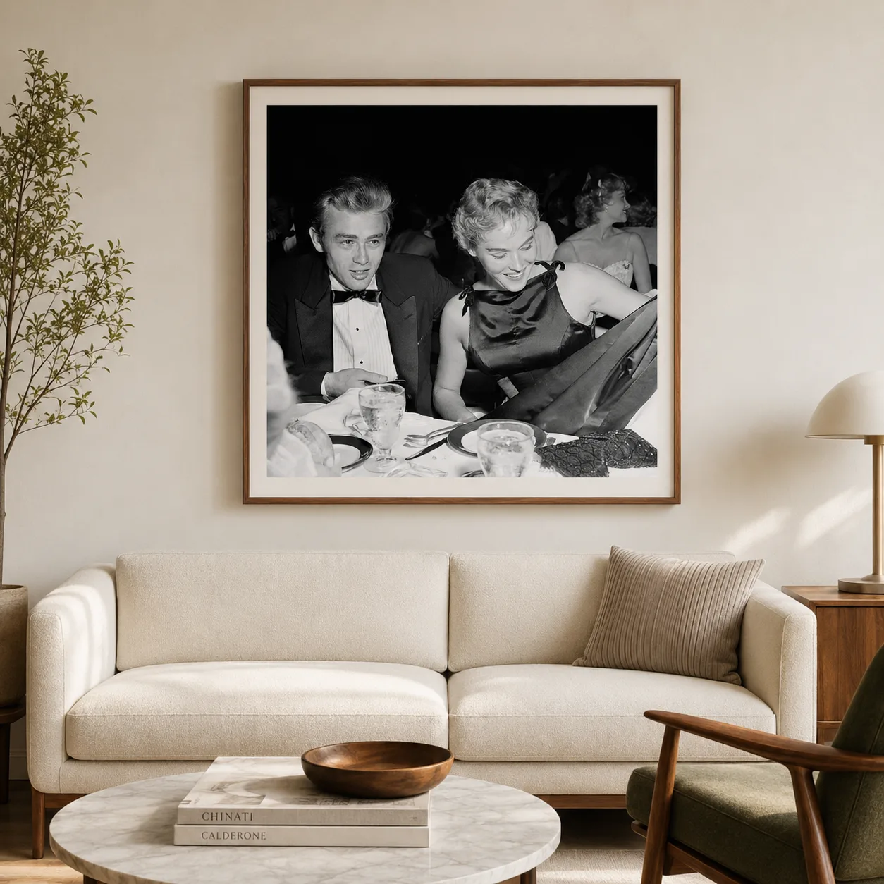 Michael Ochs — james Dean sits in formal evening wear beside Ursula Andress at a