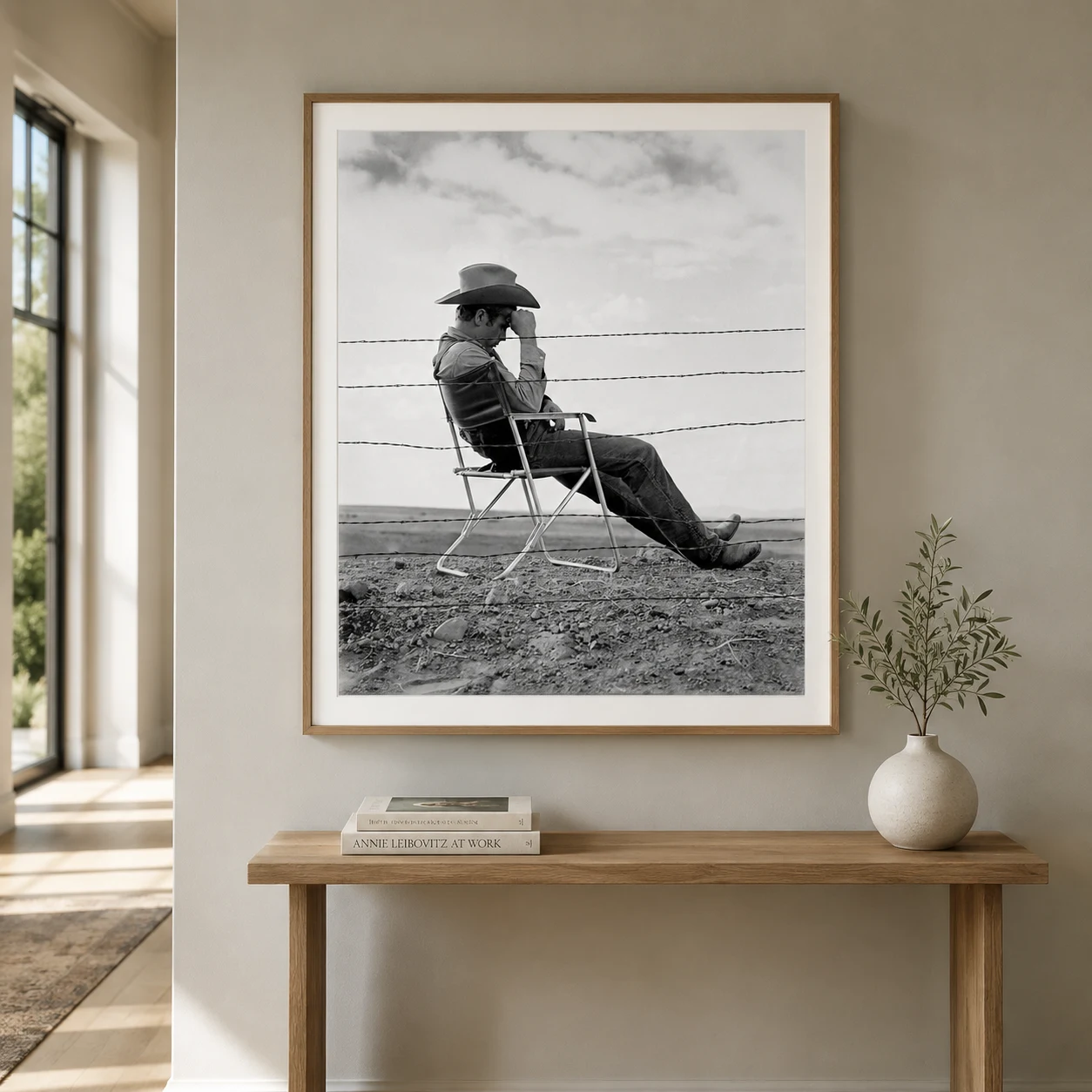 James Dean — james Dean sits in a cowboy hat behind a barbed-wire fence, with open