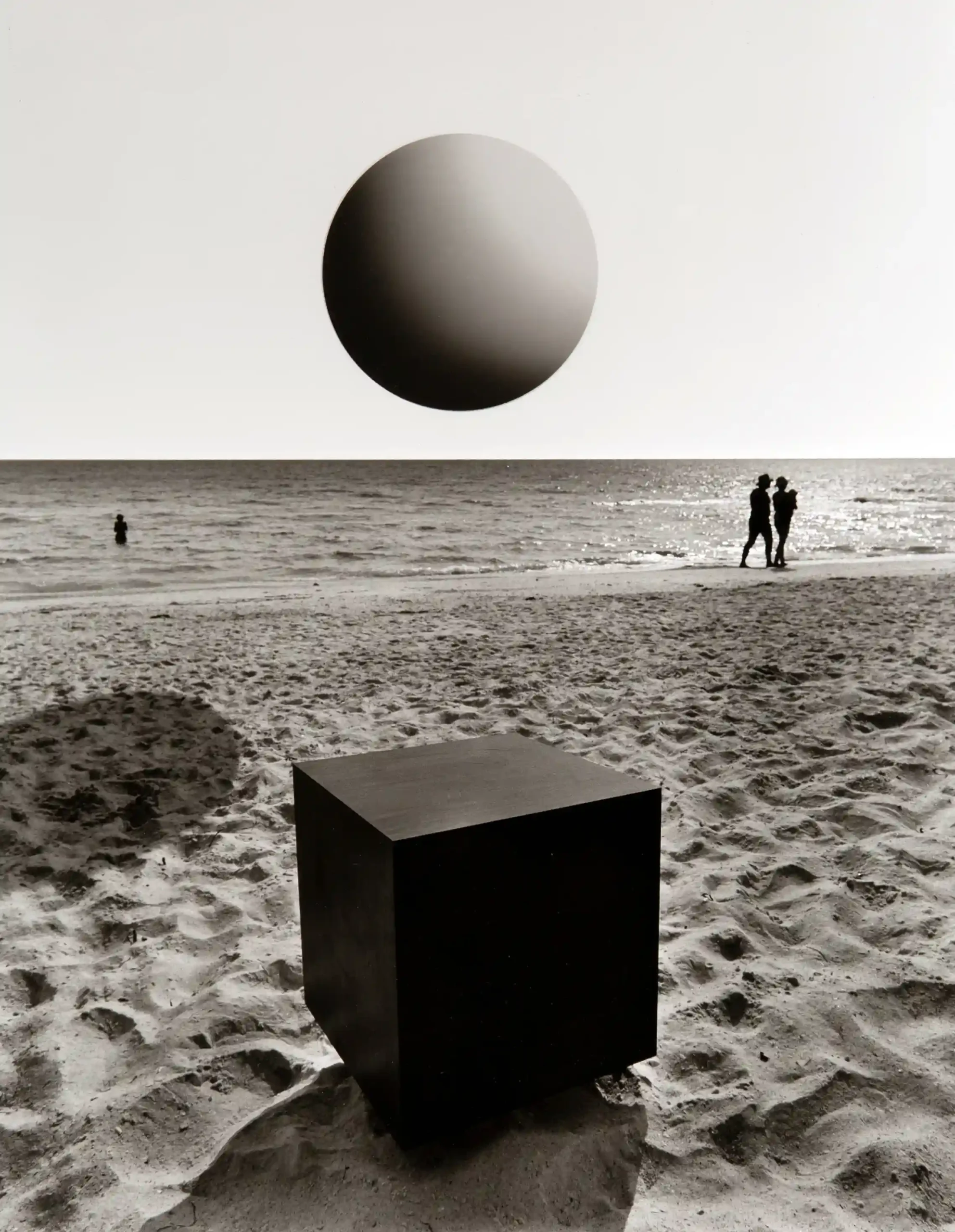 Jerry Uelsmann poster showing surreal beach shapes arranged in a dreamlike photographic scene.