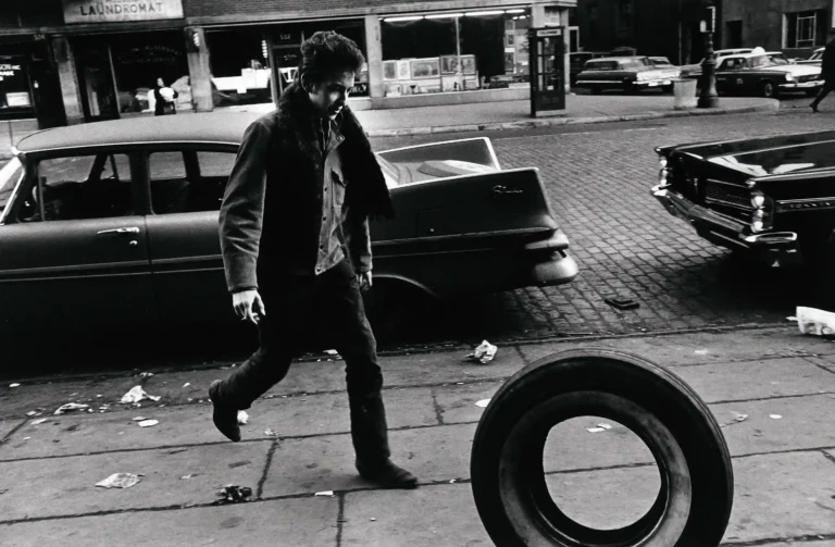 Jim Marshall poster showing Bob Dylan photographed in 1963 during his early folk years.