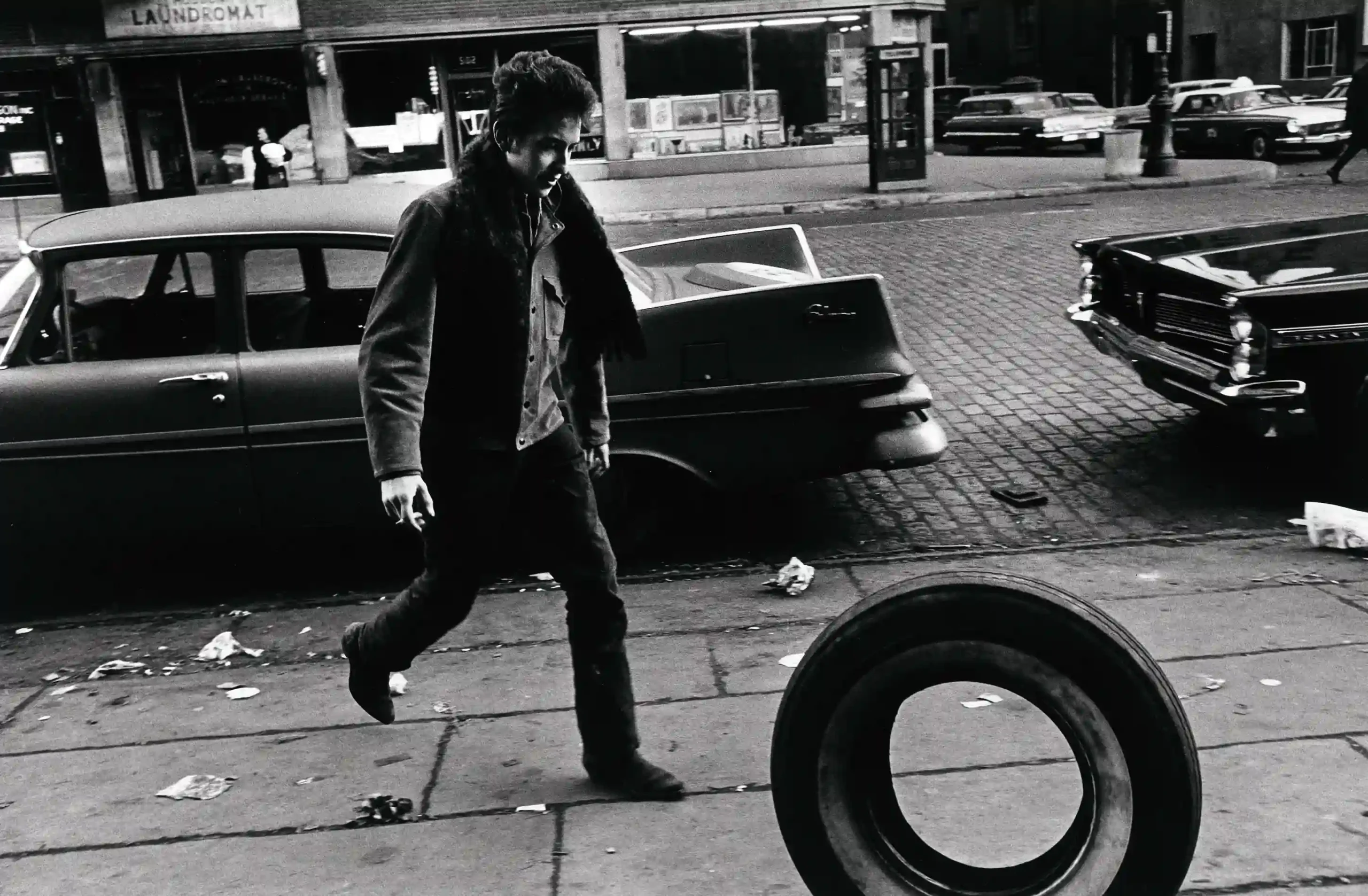 Jim Marshall poster showing Bob Dylan photographed in 1963 during his early folk years.