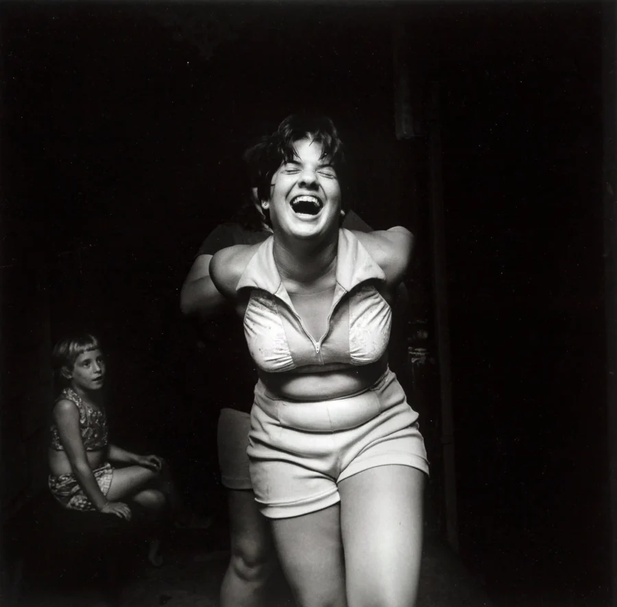Larry Fink poster showing a graduation party scene with late-1970s social detail.