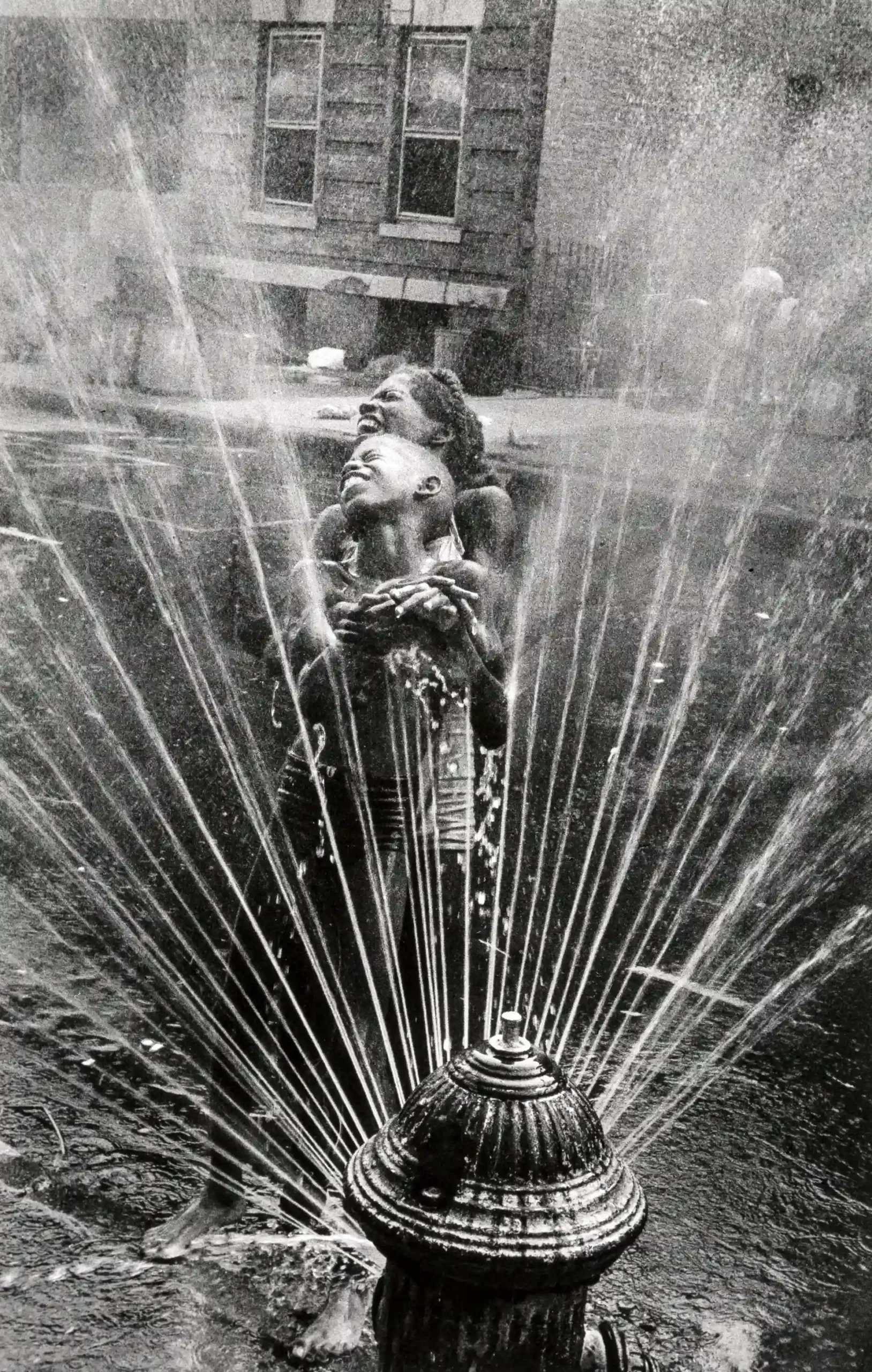 Leonard Freed poster showing a Harlem summertime hydrant scene from 1963.