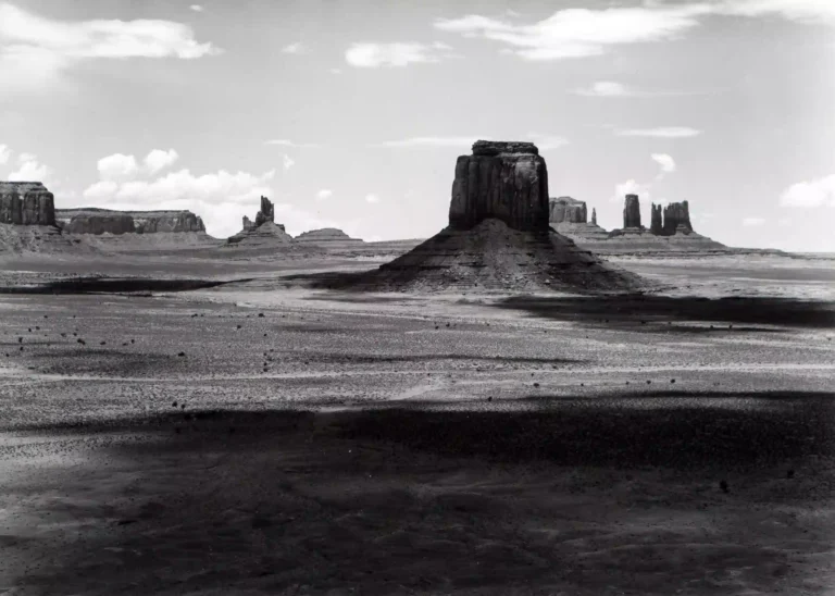 Clean artwork view of Paul Caponigro Monument Valley 1976 Photography Print. Monument Valley Photography Print presents Monument Valley 1976 by Paul Caponigro, a black-and-white image from 1976 shaped by open landscape space.