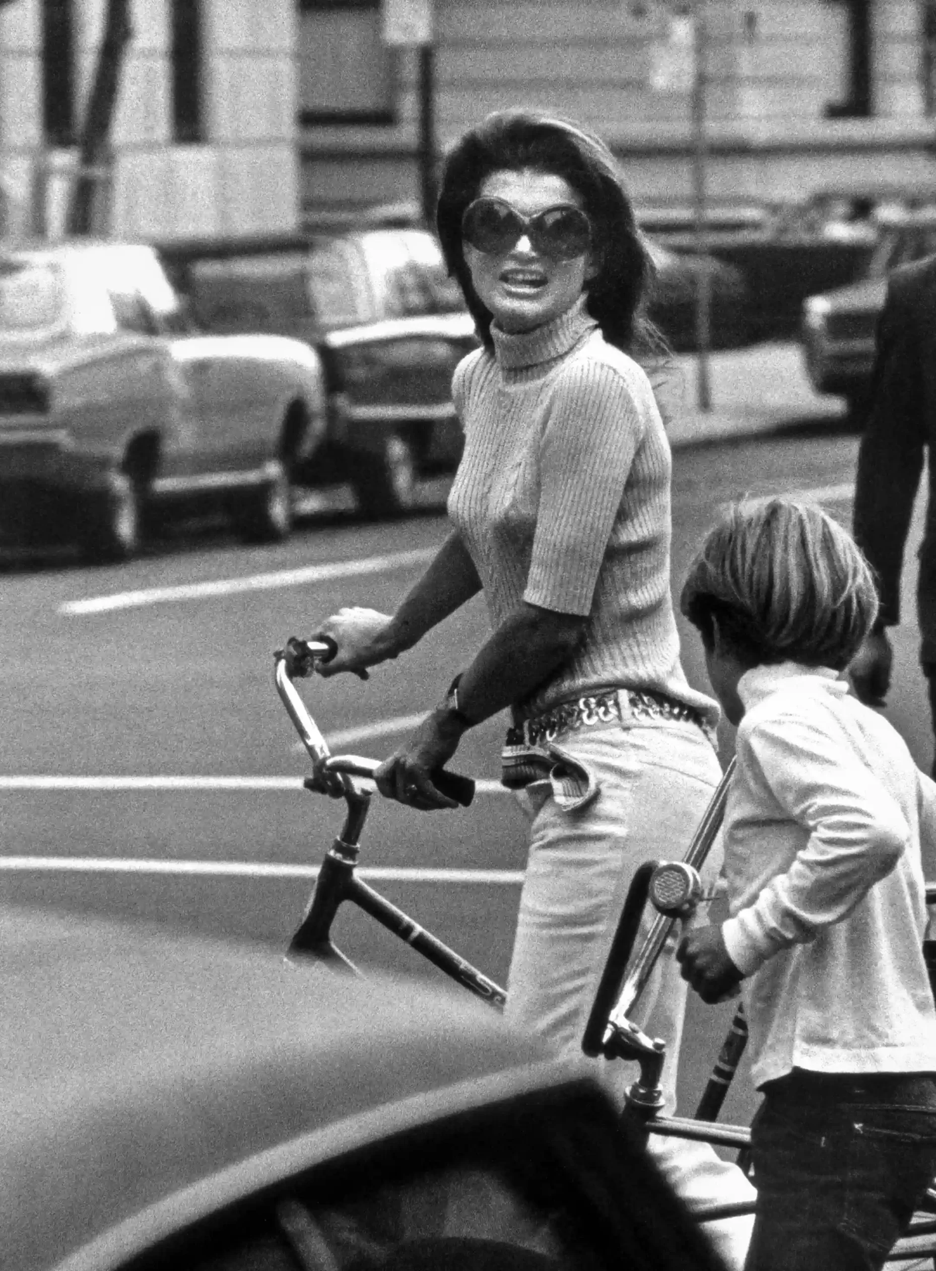 Ron Galella poster showing Jackie Kennedy walking with John Kennedy Jr. in New York.