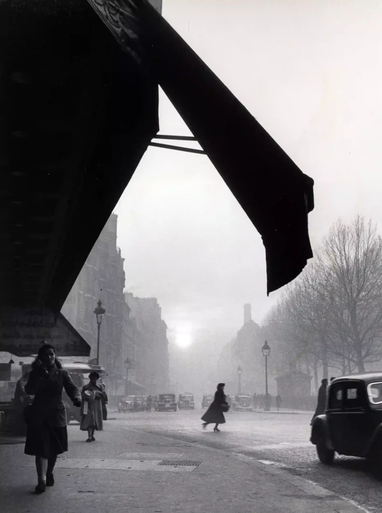 Clean artwork view of Willy Ronis Carrefour Sèvres-Babylone Paris 1948 Version 2 Photography Print. Carrefour sèvres Babylone Photography Print presents Carrefour sèvres Babylone Paris 1948 by Willy Ronis, a black-and-white image from 1948 shaped.