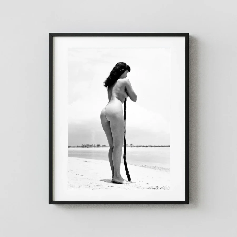 Bettie Page On The Beach 1954 Alternate View Nude displayed as a framed wall mockup