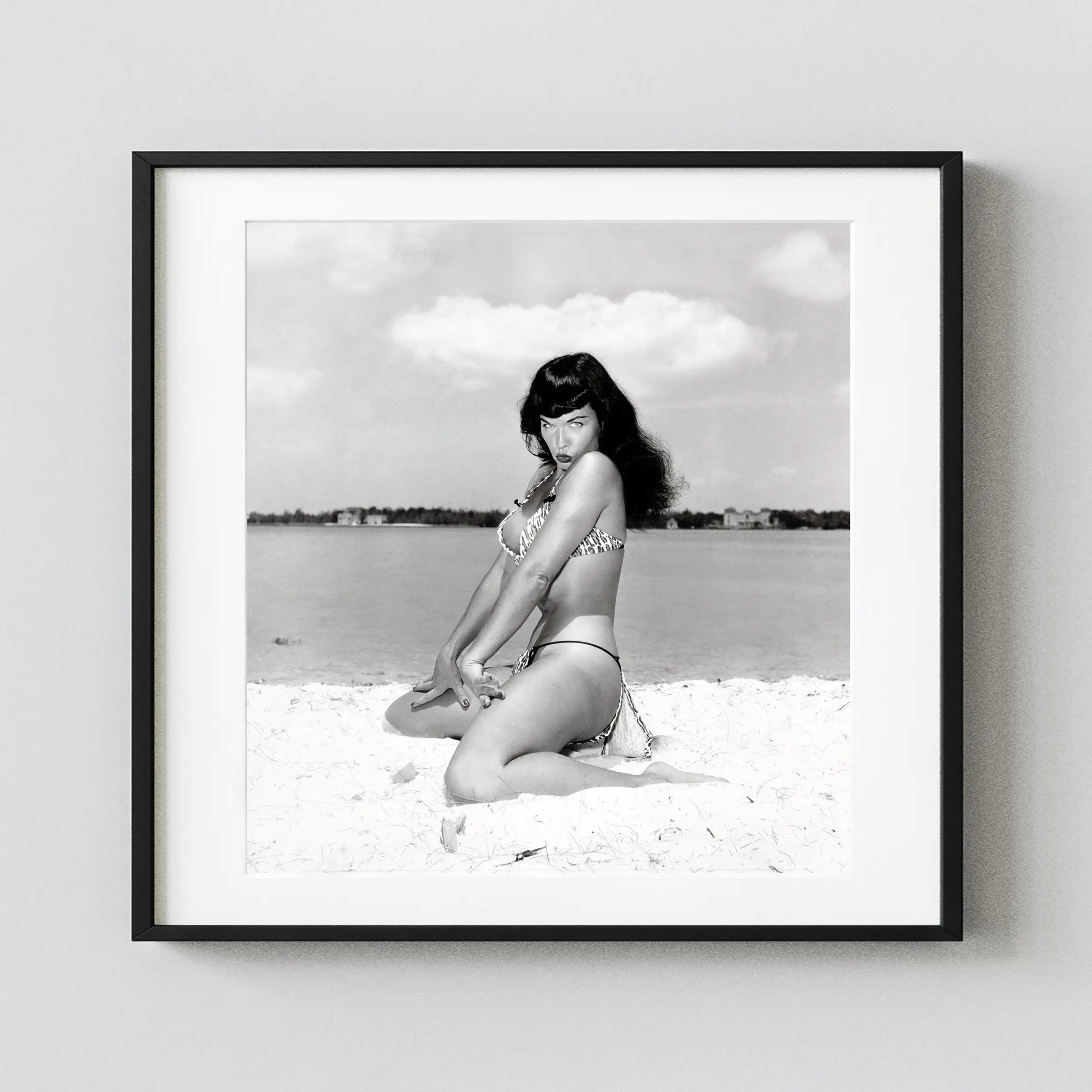 Bettie Page On The Beach 1954 Nude displayed as a framed wall mockup