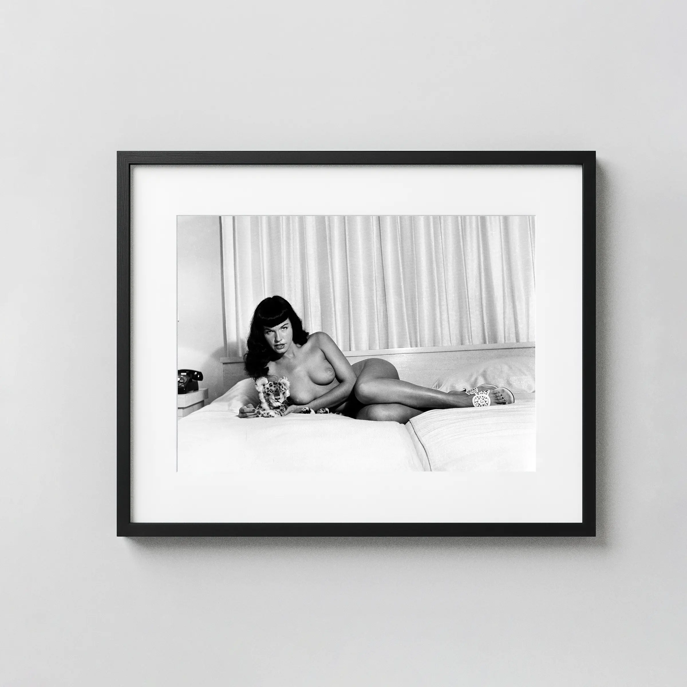 Bettie Page With A Plush Cheetah Circa 1954 Nude displayed as a framed wall mockup