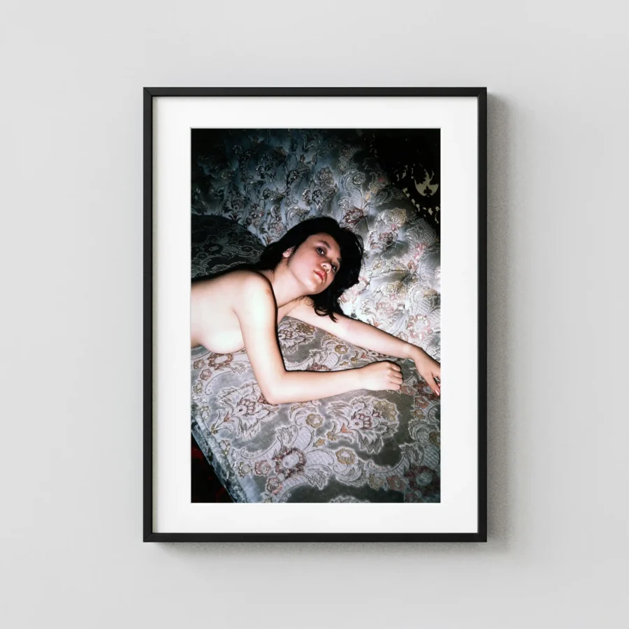 Reclining Nude on Patterned Couch 1968 displayed as a framed wall mockup