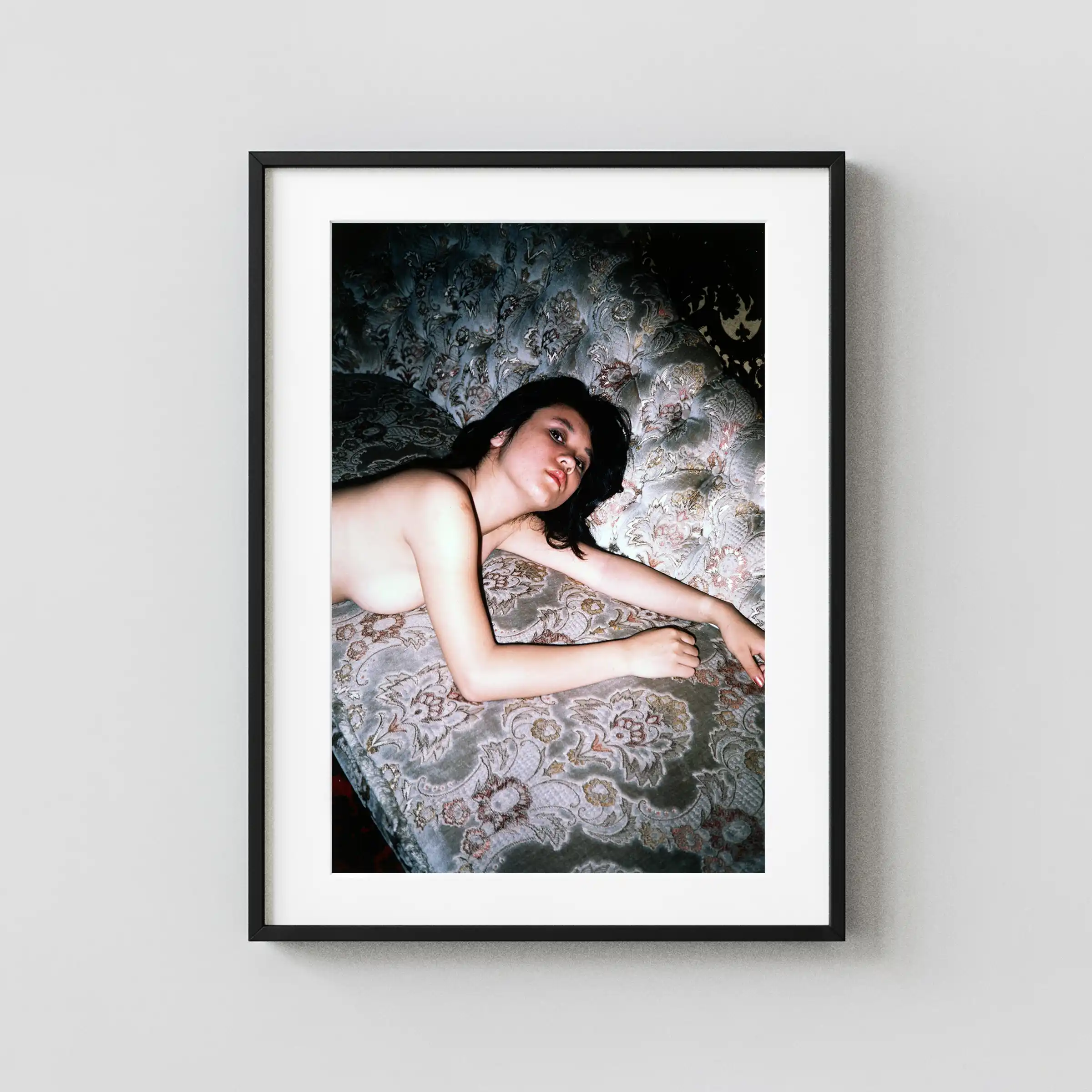 Reclining Nude on Patterned Couch 1968 displayed as a framed wall mockup
