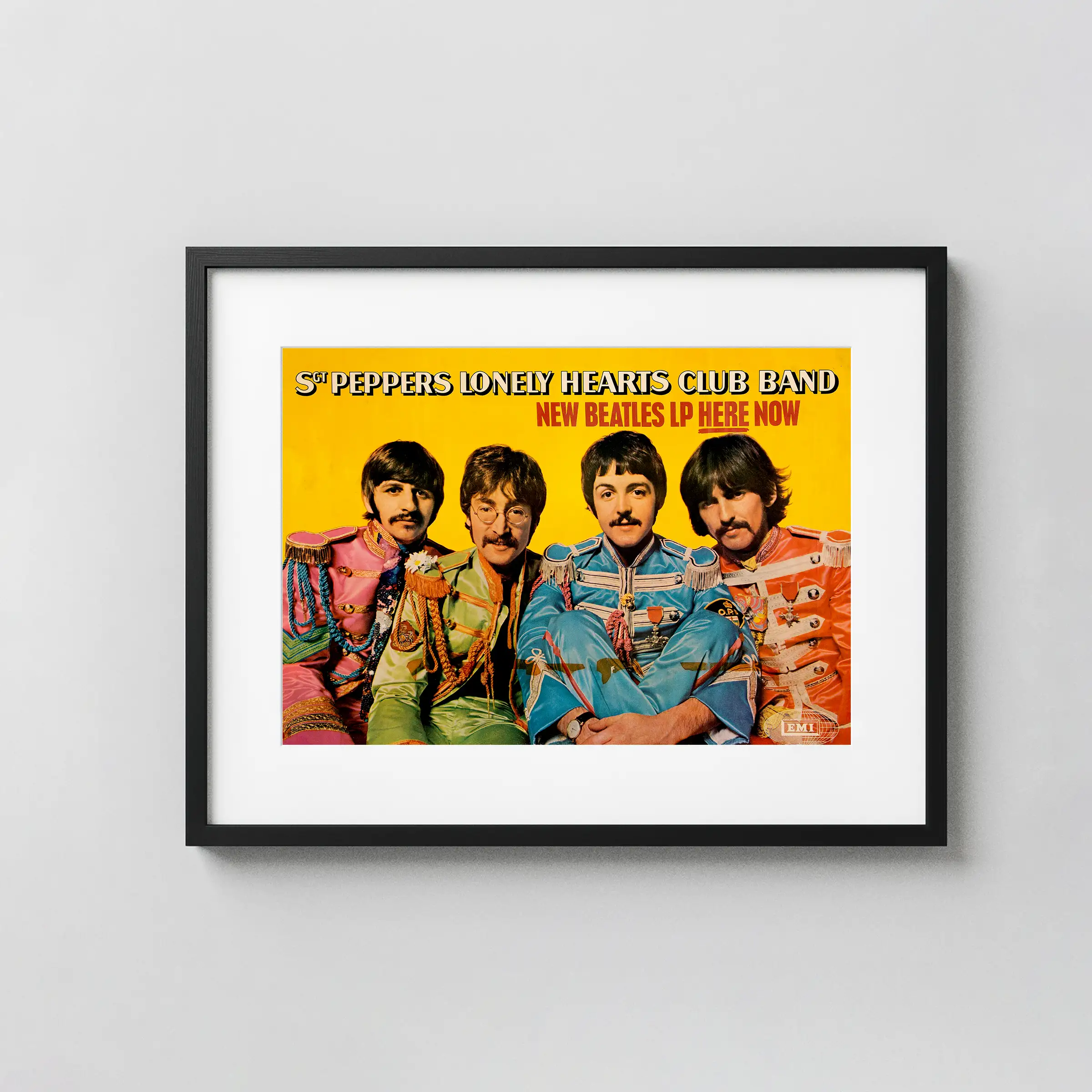 The Beatles Sgt. Pepper's Lonely Hearts Club poster with white, yellow, and light gray artwork and period lettering.