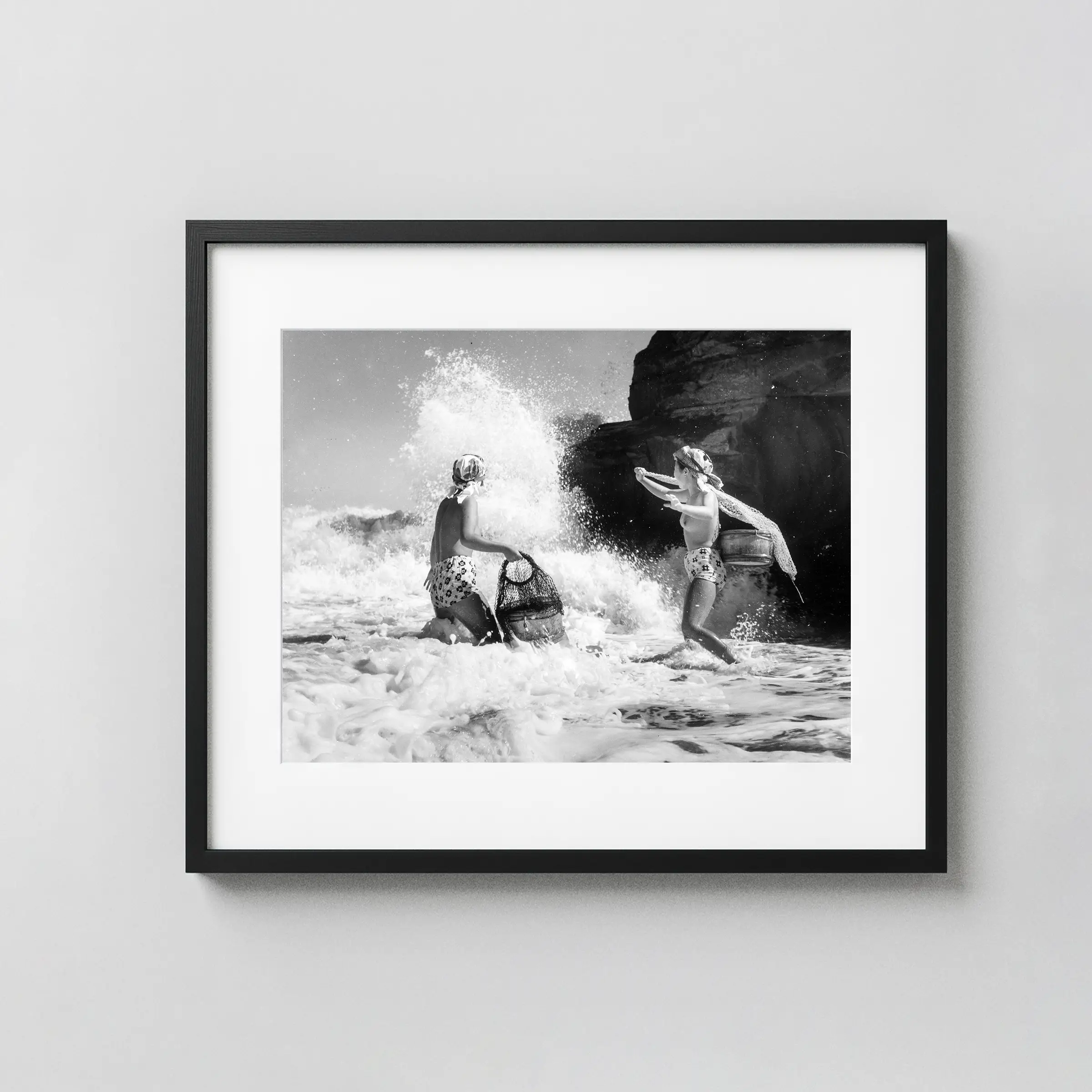 Two Ama Divers in the Surf 1950 Nude displayed as a framed wall mockup